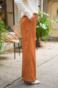 Camel colored vegan suede straight leg pants with pintuck detail, belt loops, side pockets