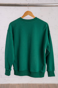 Green sweatshirt with text Homebody 8pm Club