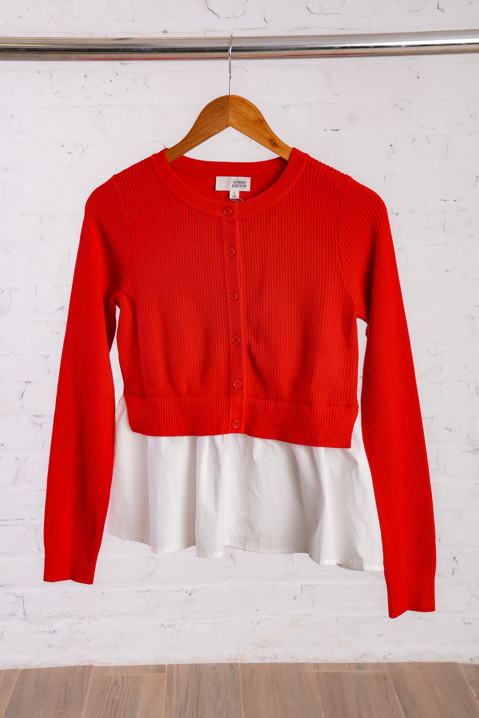 Red cardigan with a white cotton peplum bottom
