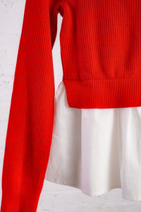 Red cardigan with a white cotton peplum bottom