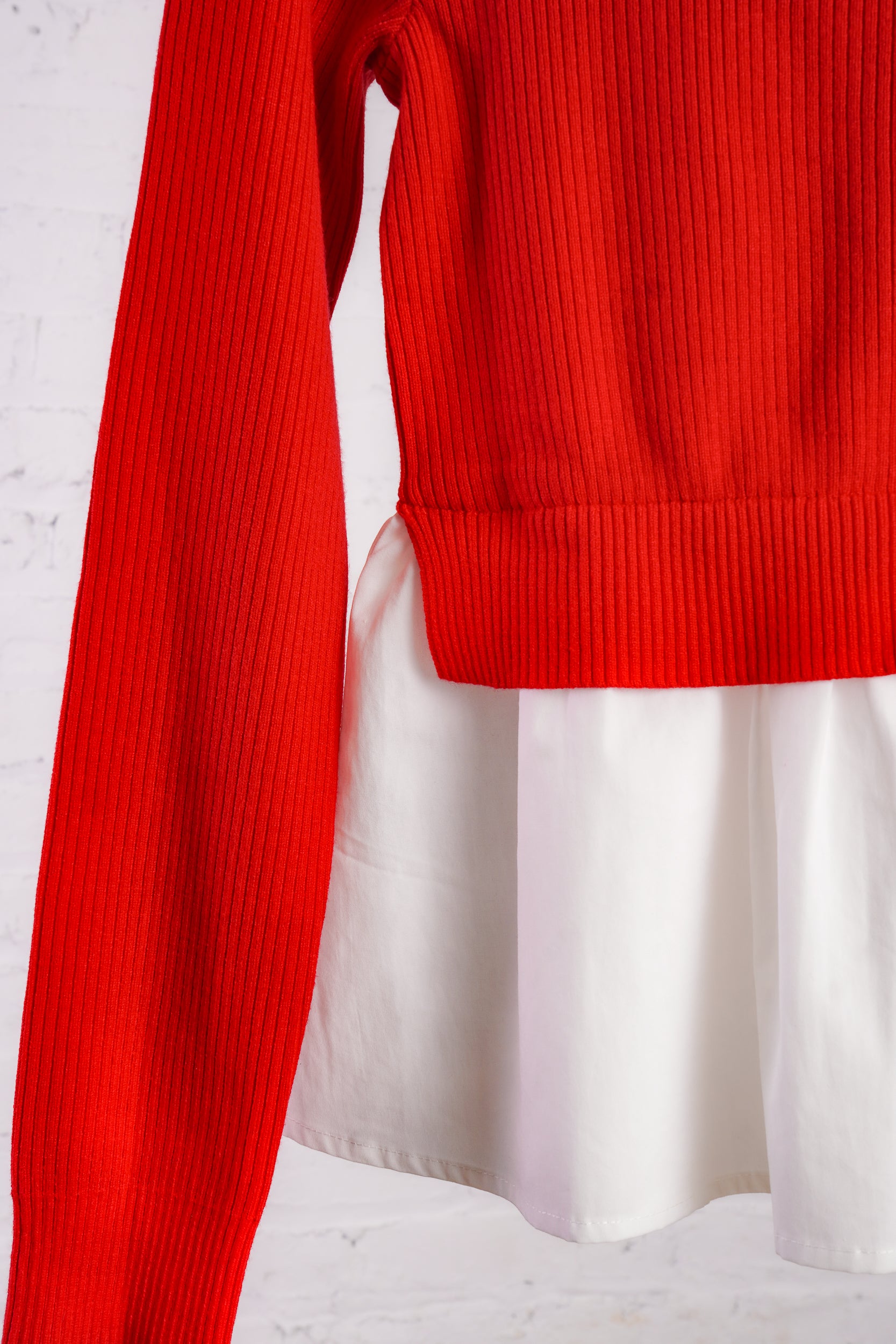 Red cardigan with a white cotton peplum bottom