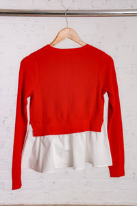 Red cardigan with a white cotton peplum bottom