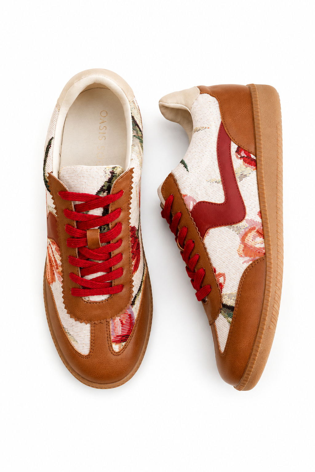 A pair of low-top sneakers shown from top and side views on a white background. The shoes feature tan leather overlays, cream fabric panels with a red and pink floral pattern, red laces, and a tan sole.
