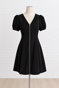 A black short-sleeve V-neck dress with puff sleeves and a front zipper