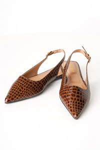 A pair of pointed-toe slingback flats in brown crocodile-embossed leather, displayed on a clean white background.
