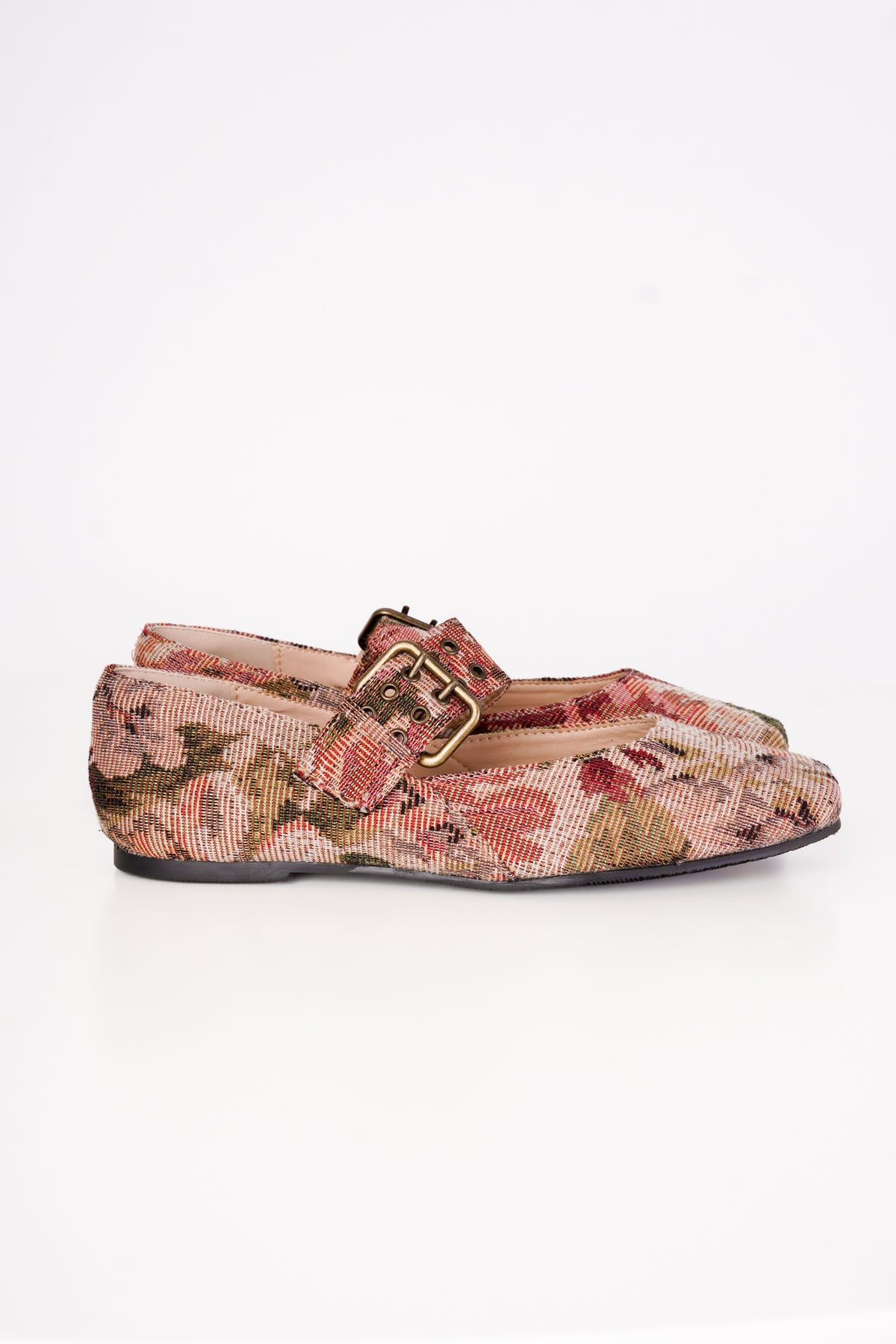 A pair of women's flat shoes featuring a textured snakeskin pattern in pink, brown, and beige, with a single strap and a gold-tone buckle across the top, photographed against a plain white background.