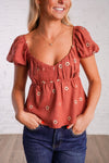 rust puff sleeve peplum top with embroidered flowers 