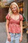 rust puff sleeve peplum top with embroidered flowers 
