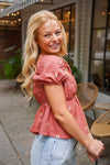 rust puff sleeve peplum top with embroidered flowers 