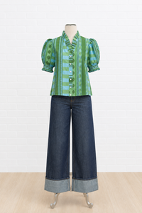 A green and blue patterned puff-sleeve blouse 
