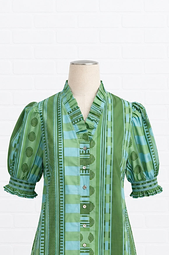 A green and light blue patterned blouse 