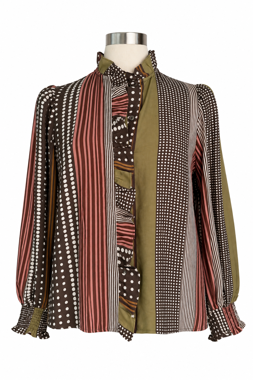 A long-sleeve button-up blouse with a patchwork design of vertical stripes, polka dots, and solid panels in olive green, brown, red, and white, displayed on a mannequin torso against a white background.