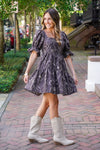 patterned dress and white boots