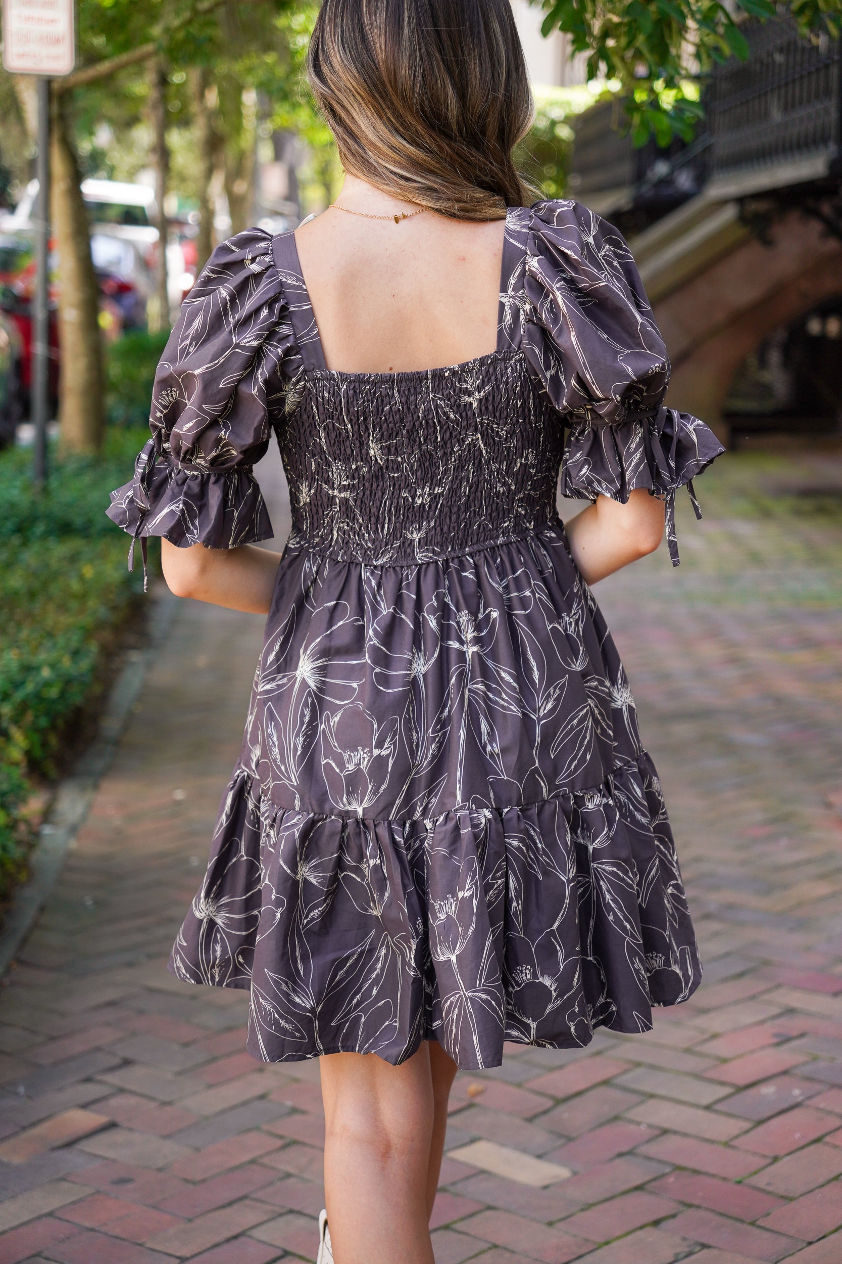 patterned dress and white boots