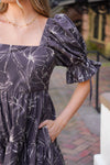 patterned dress and white boots