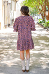 patterned short sleeve dress and white boots 