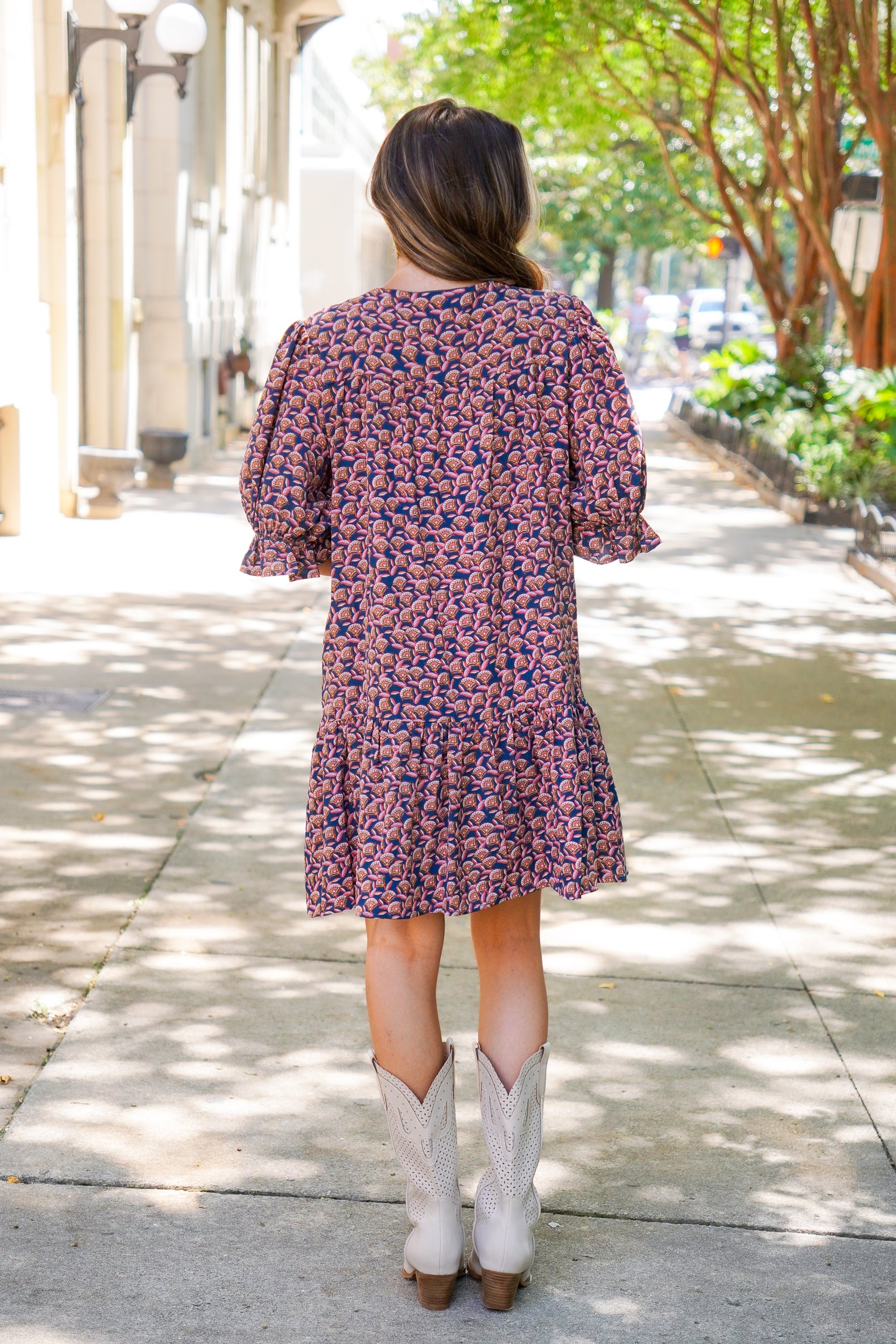 patterned short sleeve dress and white boots 