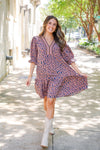 patterned short sleeve dress and white boots 
