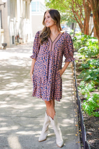 patterned short sleeve dress and white boots 