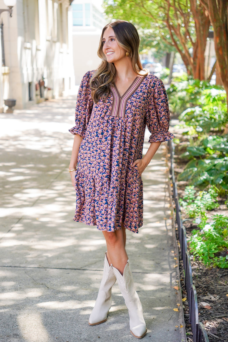 patterned short sleeve dress and white boots 