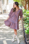 patterned short sleeve dress and white boots 