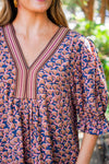 patterned short sleeve dress and white boots 