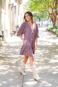 patterned short sleeve dress and white boots 