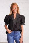 Black v-neck top with white stitching detail 