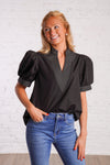 Black v-neck top with white stitching detail 