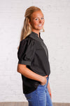 Black v-neck top with white stitching detail 