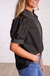 Black v-neck top with white stitching detail 