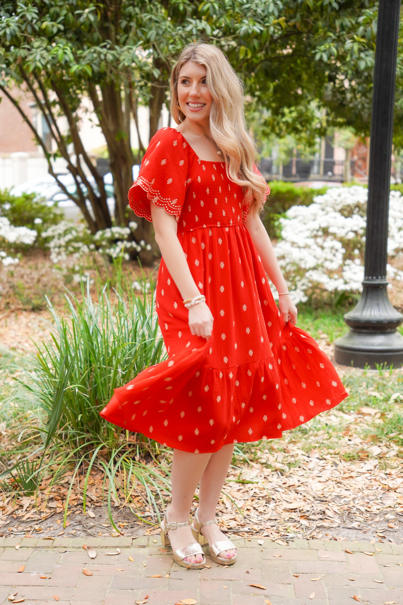 red midi dress with gold polka dots embroidered
