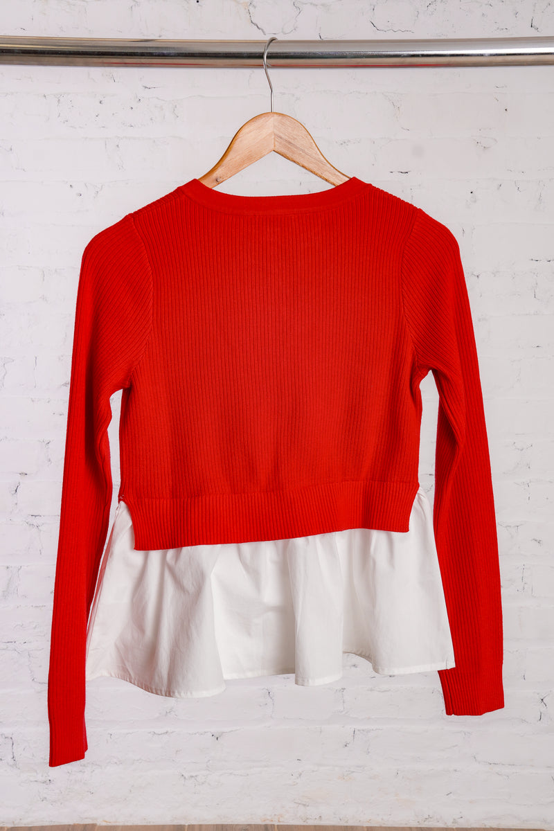 Red cardigan with a white cotton peplum bottom 
