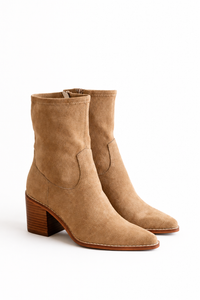 A pair of tan suede ankle boots with a stacked wooden block heel and pointed toes, shown on a clean white background.