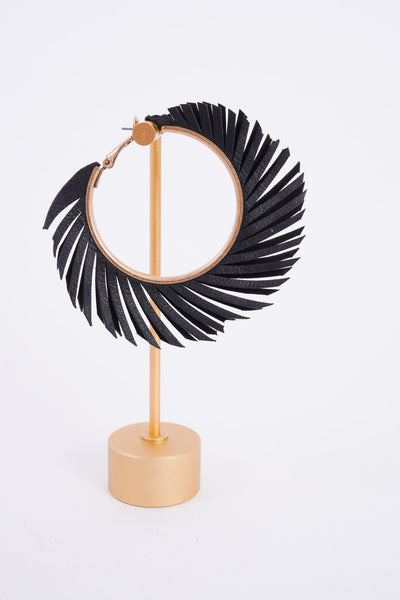 Photo shows a pair of black feather hoops made from a faux leather material.