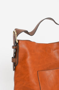 A detailed photo of the brown hobo bag. 