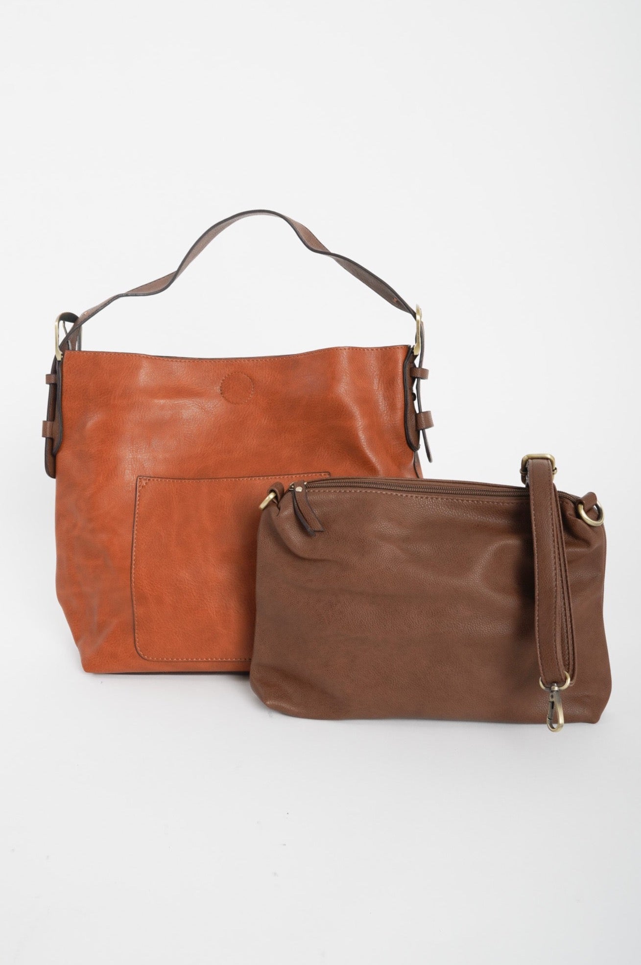 A two toned, brown hobo bag with a miniature dark brown crossbody included. 