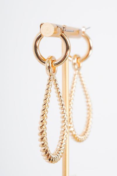  Pair of small gold hoop earrings that have an attachable gold twisted teardrop earring to it. 